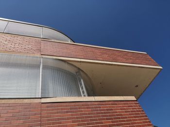 Low angle view of building against blue sky