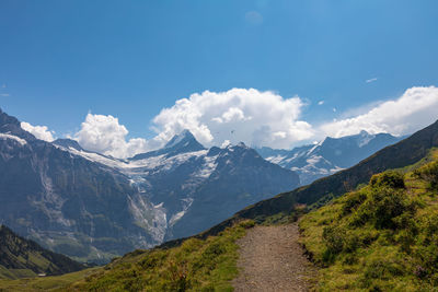 Scenic view of snowcapped mountains against sky