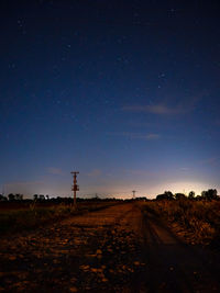 Scenic view of field against sky at night