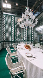 Empty chairs and tables in restaurant