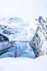 Scenic view of lake and snowcapped mountains during winter