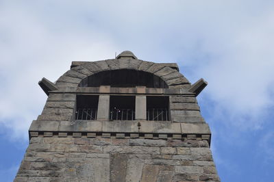 Low angle view of old building against sky