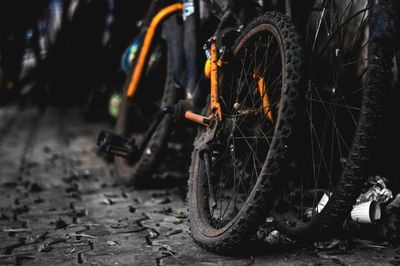 Close-up of bicycle wheel at night