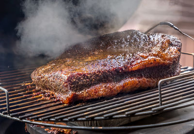 Close-up of meat on barbecue grill