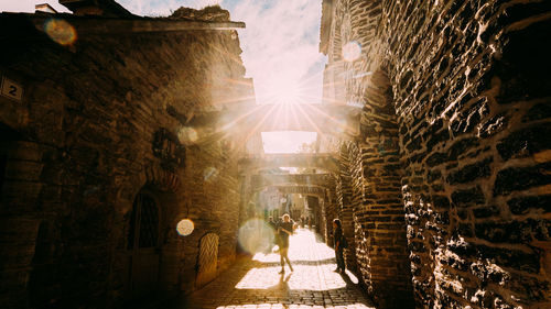 Rear view of woman walking on street