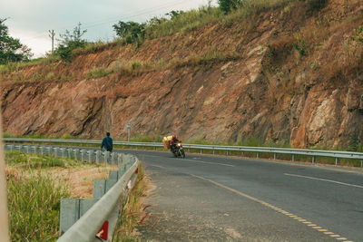 People on road against sky