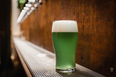 Close-up of beer glass on table