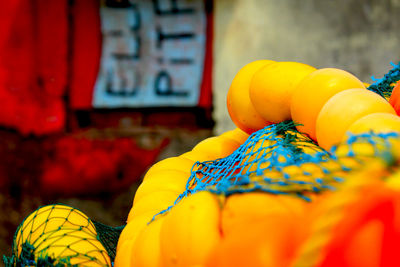 Close-up of orange fruits for sale at market stall