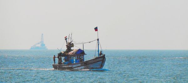 Boat sailing in sea