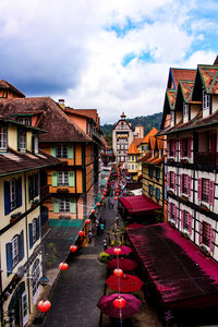 Street amidst buildings in city against sky