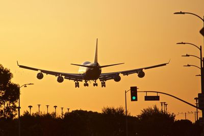 Low angle view of airplane against clear sky
