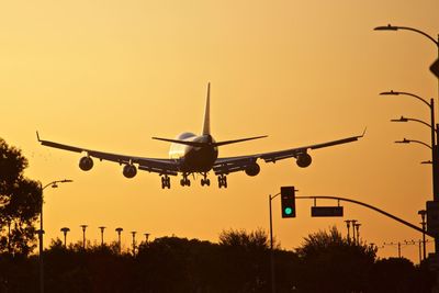 Low angle view of airplane against clear sky