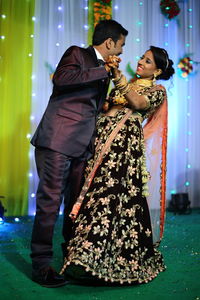 Side view of young couple during wedding ceremony