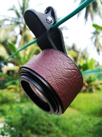 Low angle view of metal hanging on tree