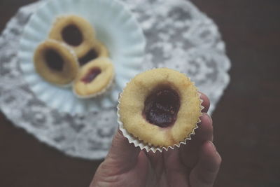 Close-up of hand holding sweet food