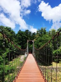 View of bridge against blue sky and clouds