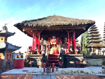 Statue in temple against sky