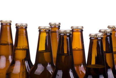 Close-up of bottles against white background