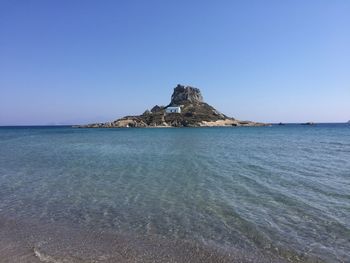 Scenic view of sea against clear blue sky