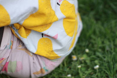 High angle view of baby girl standing on grass