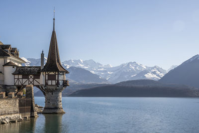 Switzerland, bern canton, thun, lake thun with oberhoffen castle in foreground