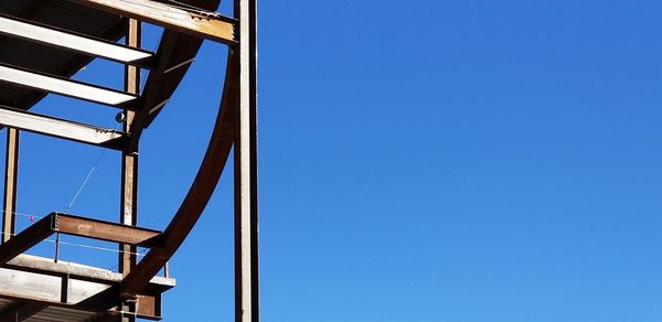 Low angle view of built structure against blue sky