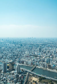 Aerial view of cityscape against sky