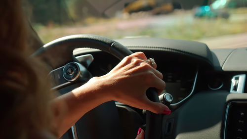 Midsection of man driving car