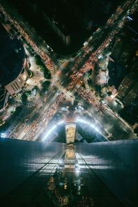 High angle view of city lit up at night