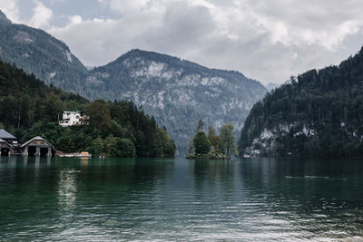 Scenic view of lake and mountains against sky