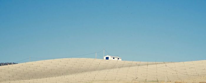 Scenic view of mountain against clear blue sky
