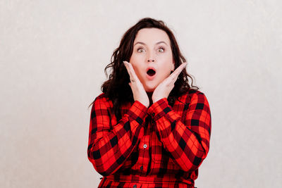 Portrait of teenage girl against white background