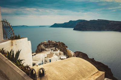 Panoramic view of sea and buildings against sky