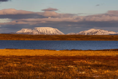 Scenic view of landscape and mountains against sky