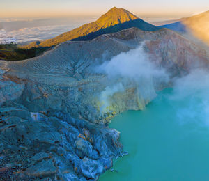 Scenic view of volcanic mountain against sky