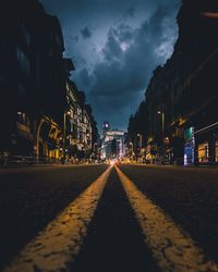 Illuminated cityscape against sky at night