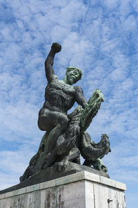 Low angle view of statue against sky