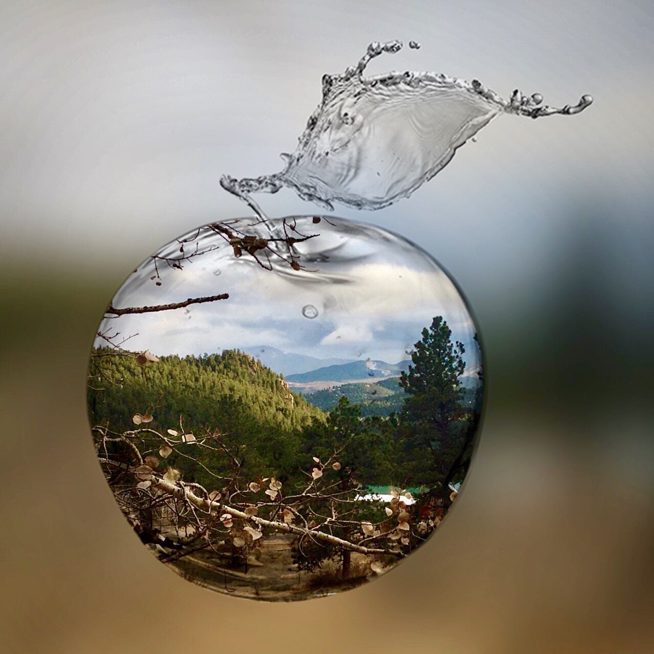 CLOSE-UP OF GLASS SPLASHING WATER