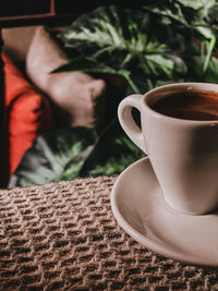 Close-up of coffee cup on table