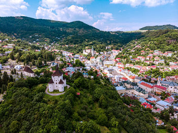 Panorama of townscape of old town and mountains against sky