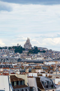 Paris cityscape from above. montmartre hill and sacre coer church stand out in the view