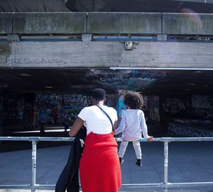 Full length rear view of woman standing in park