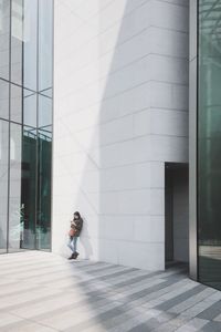 Woman in front of building