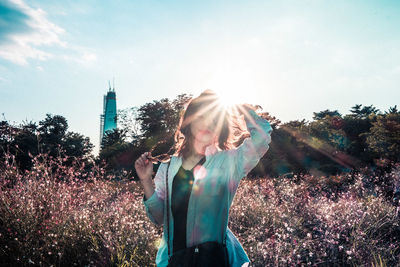 Silhouette of woman against sky