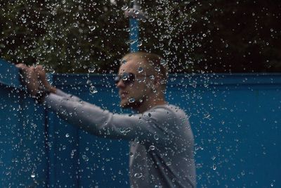 Water falling with man in background