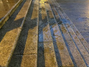 High angle view of wet zebra crossing on road