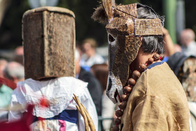 Man wearing costume on street during festival