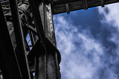 Low angle view of building against cloudy sky