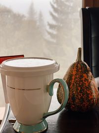 Close-up of coffee cup on table