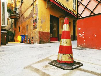 View of garbage can against built structure